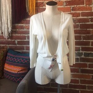 Delia’s white cardigan with buttons lewk